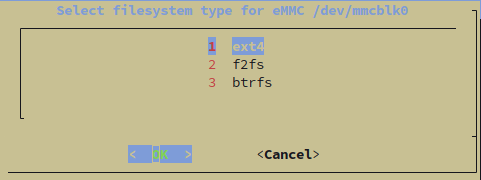 Armbian install dialog showing filesystem type selection for eMMC with ext4, f2fs, and btrfs options, ext4 highlighted