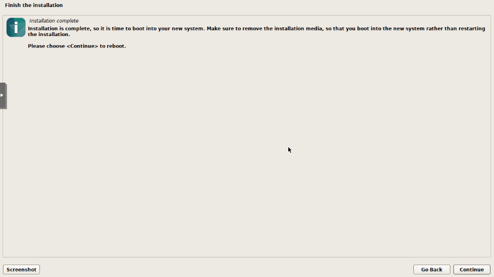 Debian installer completion screen showing Installation complete message with prompt to reboot